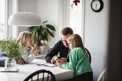 Father with daughters at home