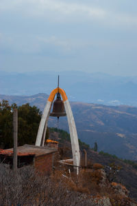 Built structure on landscape against sky