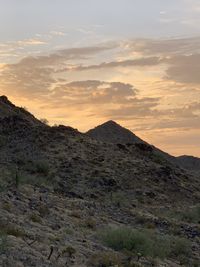 Scenic view of mountains against sky during sunset