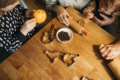 Mother with children making cookies