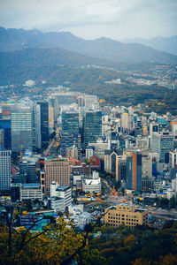 High angle view of buildings in city against sky