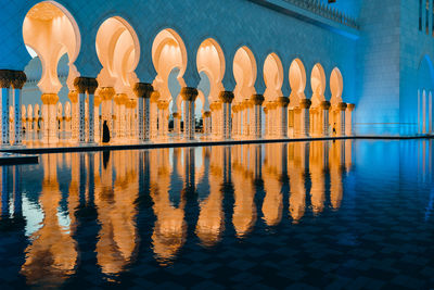 Reflection of buildings in swimming pool