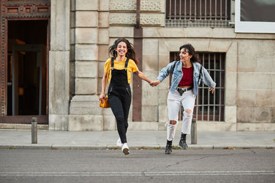 Women walking on street in city