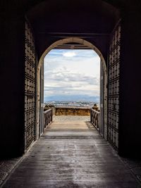 Empty entrance of historic building against sky