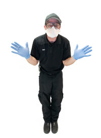 Portrait of man standing against white background