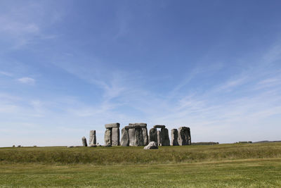 Ruins of building on field against sky