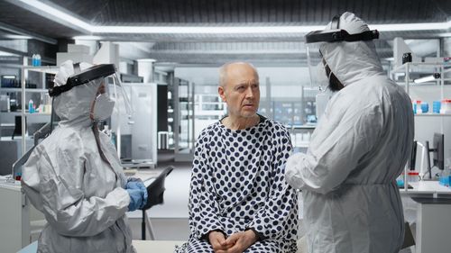 Rear view of woman standing in laboratory