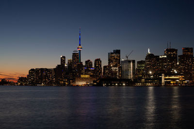 Illuminated buildings in city at night