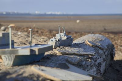 Model boats on a wooden log