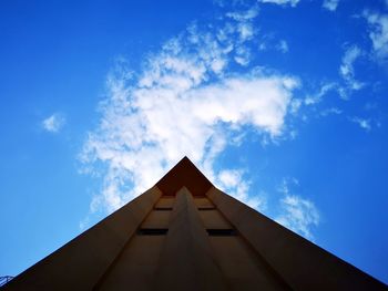 Low angle view of building against blue sky