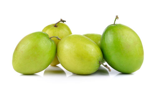 Close-up of apples on green background