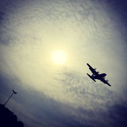 Low angle view of airplane flying in sky