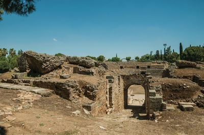 Arched entrance to the roman amphitheater at the huge archaeological site of merida, spain.