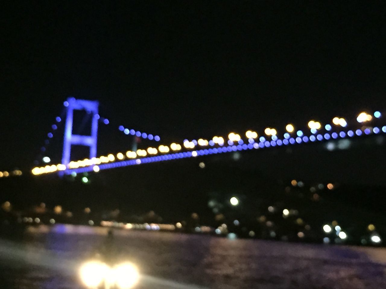 illuminated, night, water, bridge - man made structure, architecture, built structure, waterfront, connection, river, reflection, clear sky, engineering, copy space, city, transportation, bridge, building exterior, sky, light - natural phenomenon, outdoors