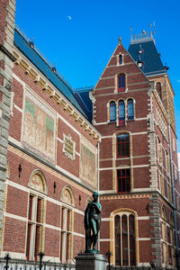 Low angle view of statue against building