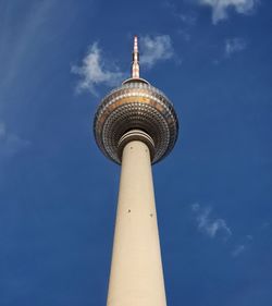 Low angle view of communications tower against sky