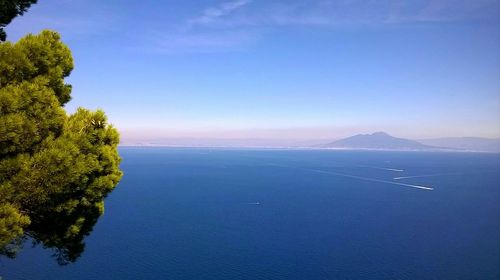 Scenic view of sea against blue sky