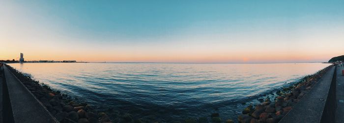 Panoramic view of sea against clear sky during sunset