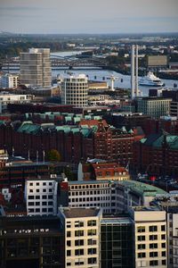 High angle view of buildings in city against sky