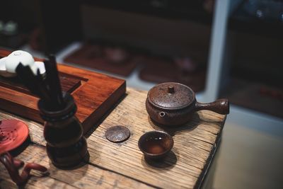 High angle view of tea with traditional utensils on table