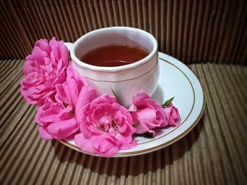 High angle view of pink roses on table