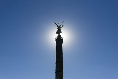 Low angle view of victory column against clear blue sky