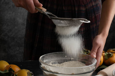 Midsection of man preparing food