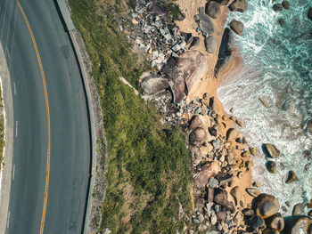 High angle view of road by beach and sea