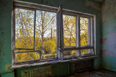Close-up of abandoned house window