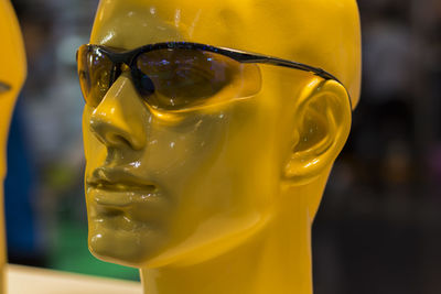 Close-up of yellow statue