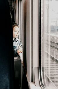 Railroad track seen through window