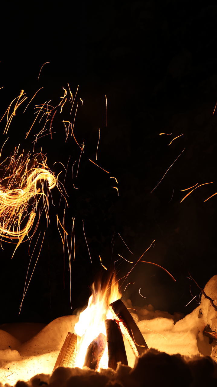 burning, motion, darkness, heat, night, sparkler, fire, light, flame, blurred motion, nature, glowing, one person, fireworks, warning sign, long exposure, event, sign, orange color, bonfire, campfire