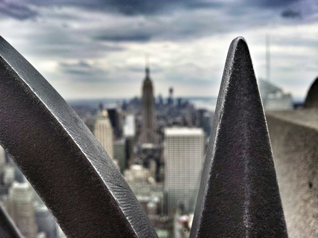 architecture, built structure, building exterior, sky, city, cityscape, cloud - sky, skyscraper, focus on foreground, cloudy, cloud, tower, close-up, day, capital cities, metal, outdoors, river, modern, no people