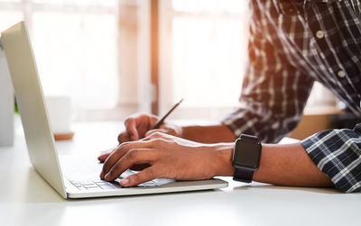 Man using laptop on table