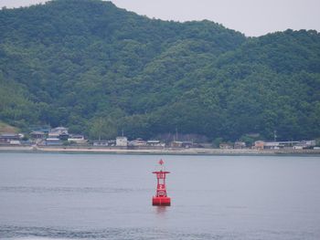 Scenic view of sea against mountain