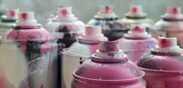 Close-up of pink spray bottles