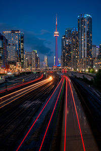 High angle view of light trails on highway at night