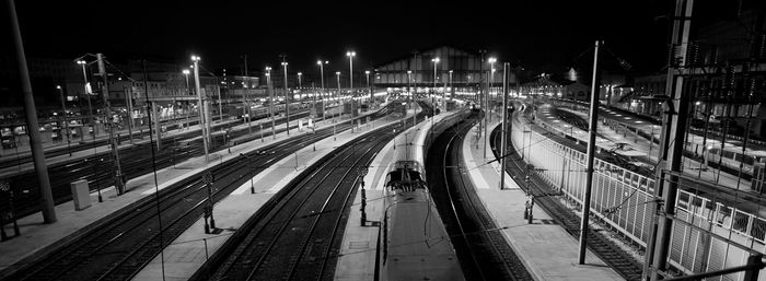 High angle view of railroad tracks at night