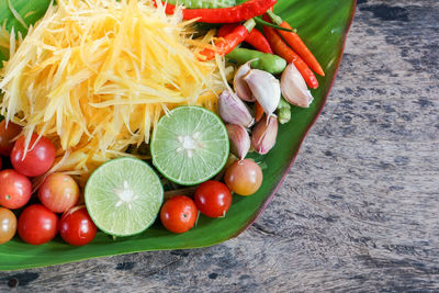 High angle view of chopped fruits in container