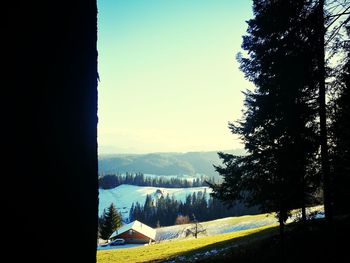 View of landscape with mountain range in background
