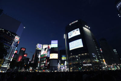 Low angle view of illuminated city at night