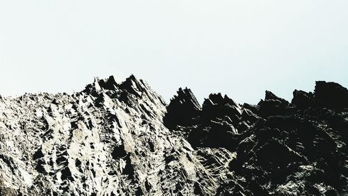 Low angle view of rock formation against clear sky