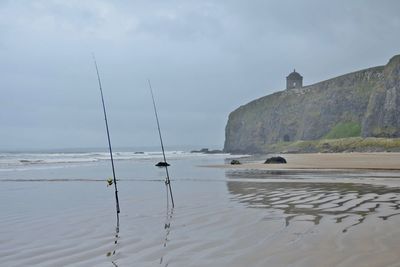 Sailboats on sea against sky