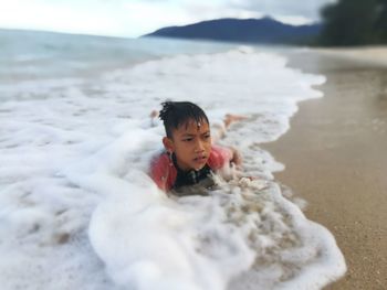 Cute boy on beach