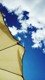 Low angle view of sunshade against sky