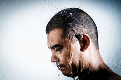 Close-up portrait of young man in water