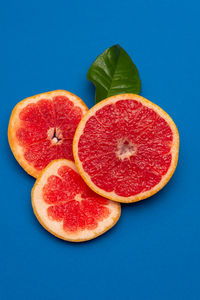 Close-up of fruits against blue background