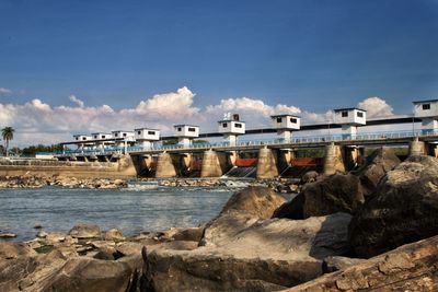 View of dam by sea against sky