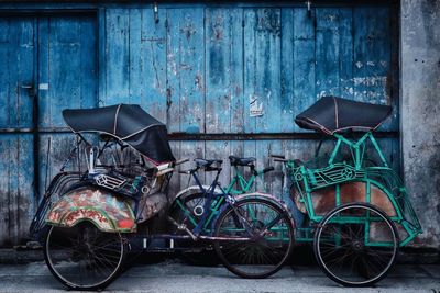 Bicycle parked against wall