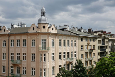 Buildings in city against sky